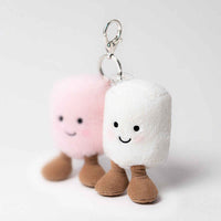 
              Two plush keychains shaped like marshmallows with smiling faces on a light gray background.
            