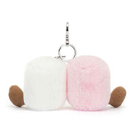
              Two-tone white and pink fluffy keychain with brown accents on a white background
            