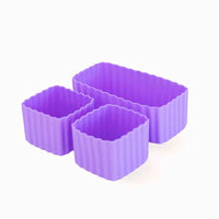 
              A set of three purple silicone bento cups of different sizes, with one rectangular and two square cups.
            