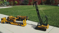 
              video crawler crane loading onto flat bed truck
            